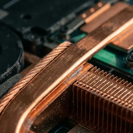 Macro view of a laptop copper heat pipe and heatsink fins