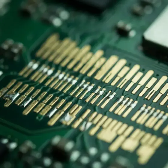 Macro view of gold-plated contact pads on a mainboard